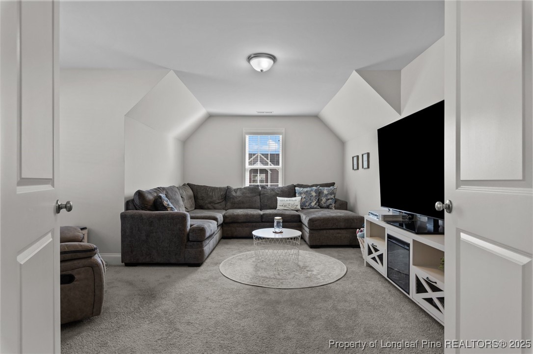 1660 Stackhouse Drive Fayetteville, NC 28314 - Photo 34 of 44 a living room with furniture and a flat screen tv