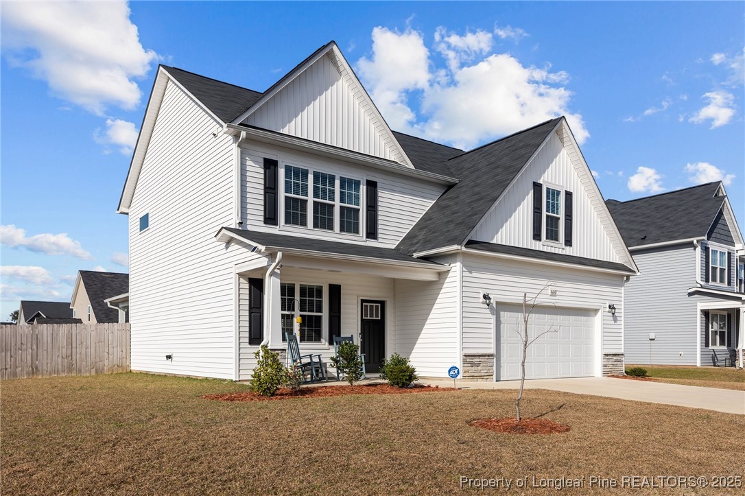 1660 Stackhouse Drive Fayetteville, NC 28314 - Photo 5 of 44 a front view of a house with a yard