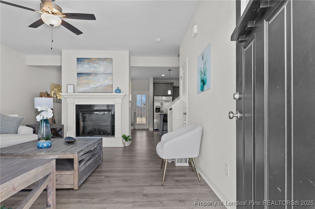 1660 Stackhouse Drive Fayetteville, NC 28314 - Photo 10 of 44 a living room with furniture wooden floor and a fireplace