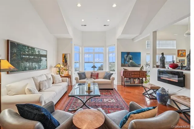 a living room with furniture or couch and a flat screen tv