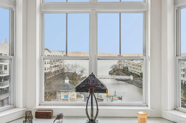 a bathroom with a bathtub and next to a window