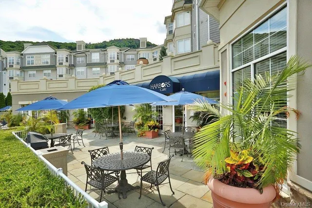a view of a chairs and table in patio
