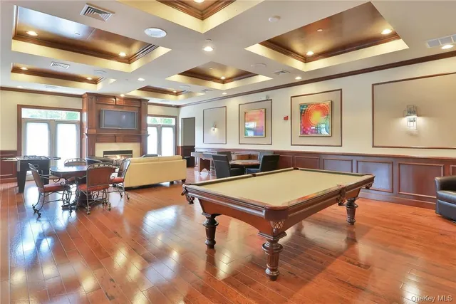 a room with furniture and pool table