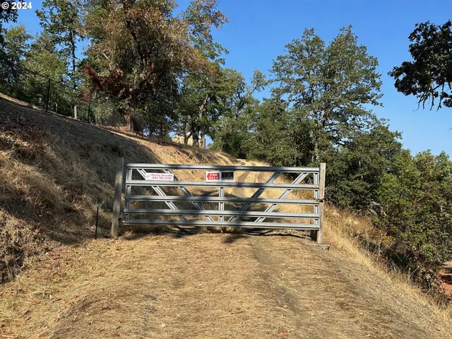 a wooden bench sitting in the middle of a yard