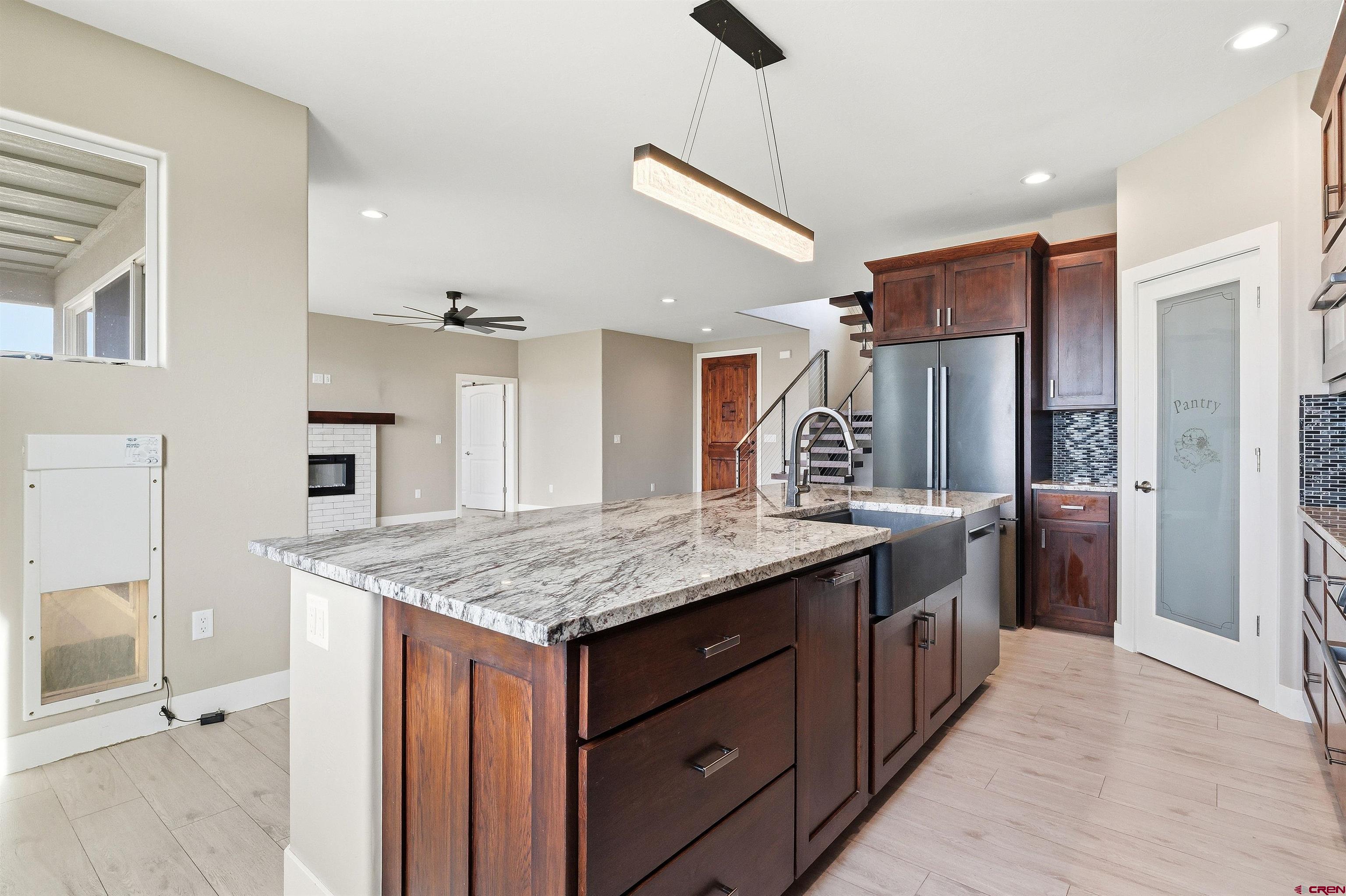 3614 Ridgeline Drive Montrose, CO 81401 - Photo 14 of 45 a kitchen with a stove a refrigerator and a sink