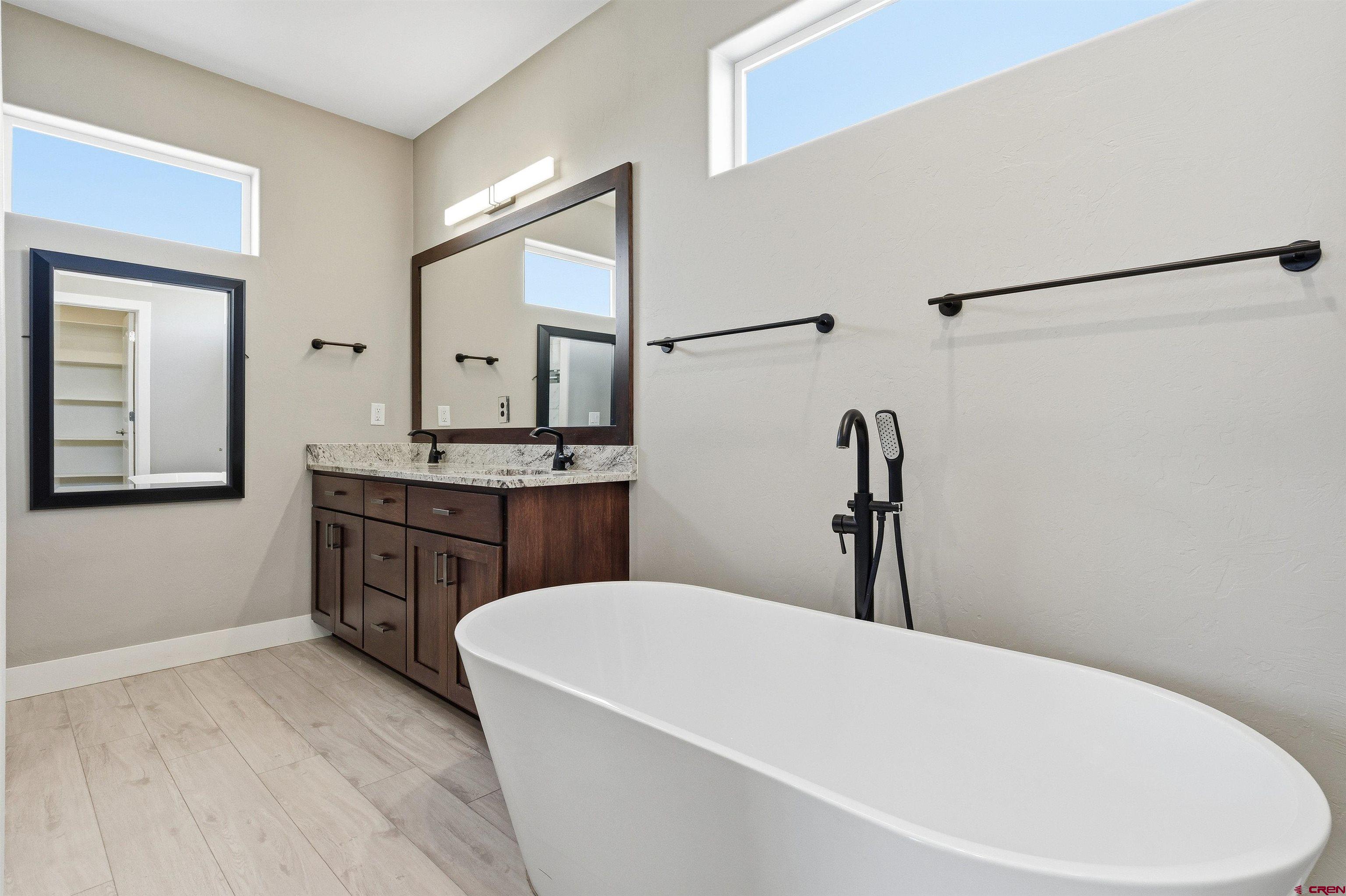 3614 Ridgeline Drive Montrose, CO 81401 - Photo 24 of 45 a bathroom with a bathtub and a sink