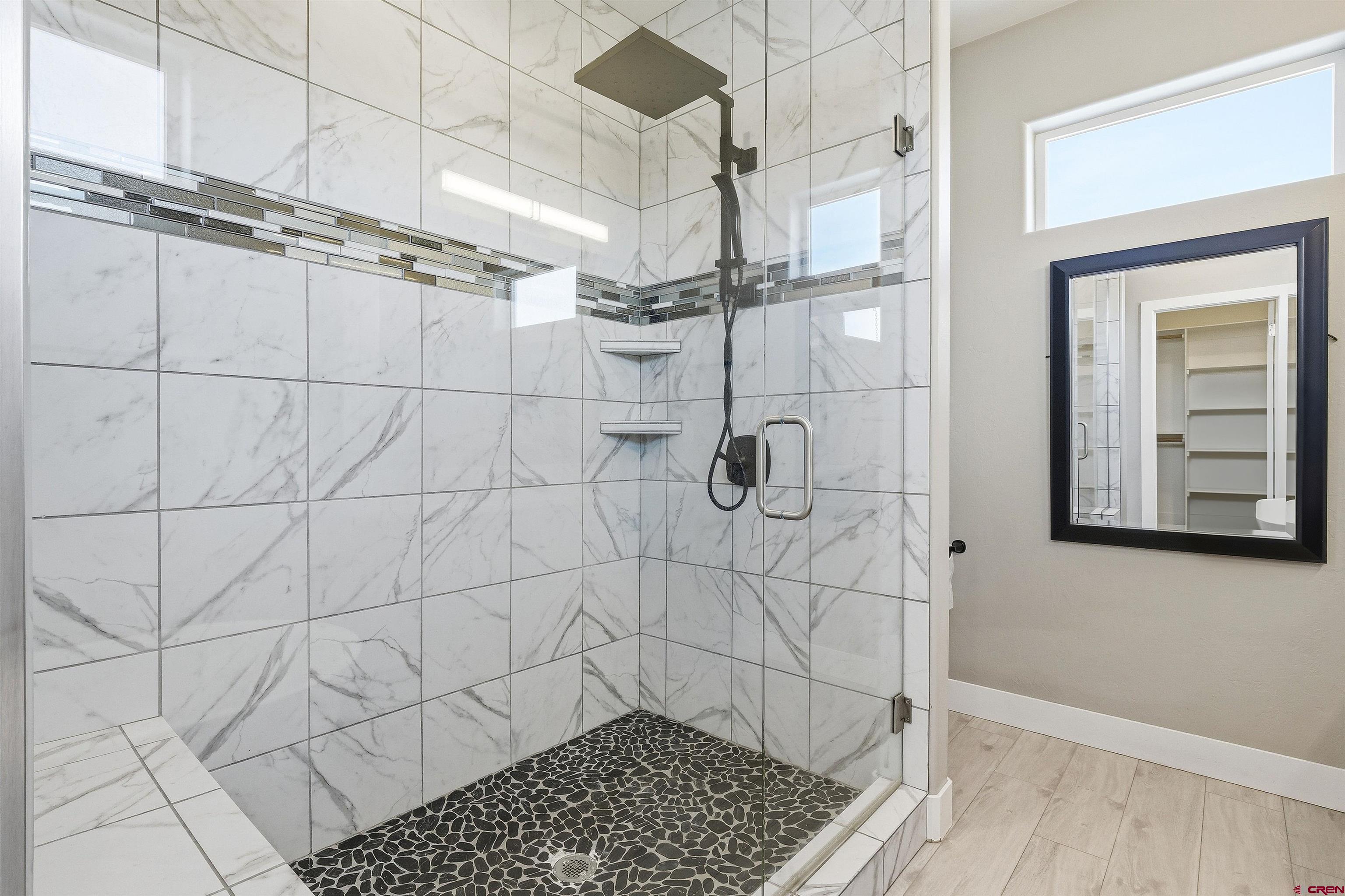 3614 Ridgeline Drive Montrose, CO 81401 - Photo 27 of 45 a bathroom with a shower