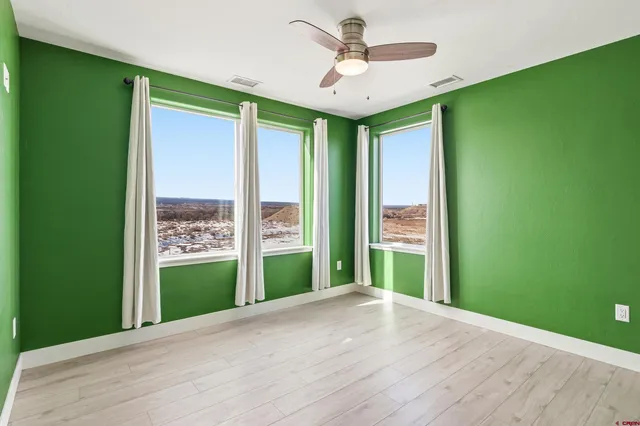 a view interior of a house and an empty room with a window