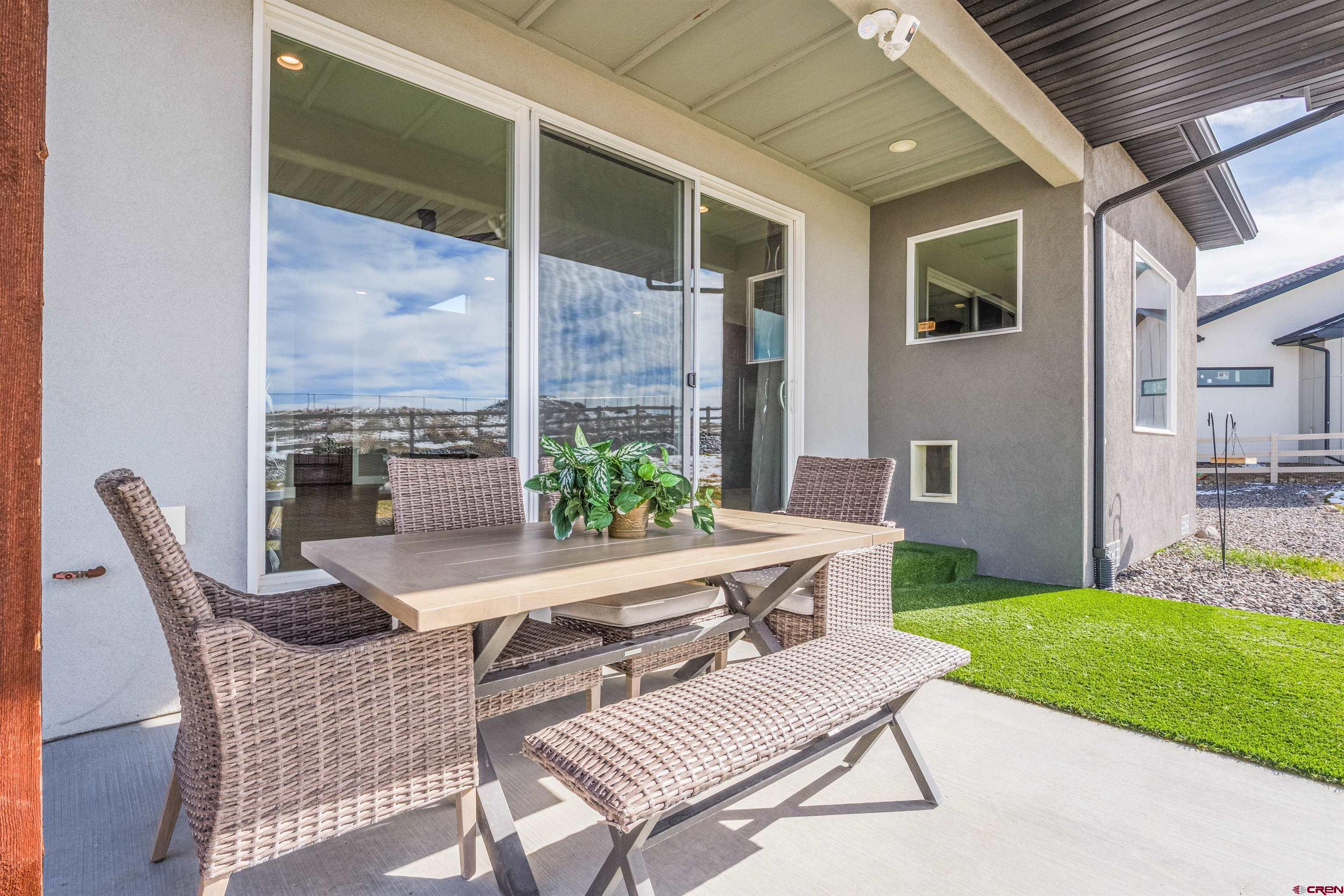 3614 Ridgeline Drive Montrose, CO 81401 - Photo 34 of 45 a view of an outdoor dining space with a table and chairs