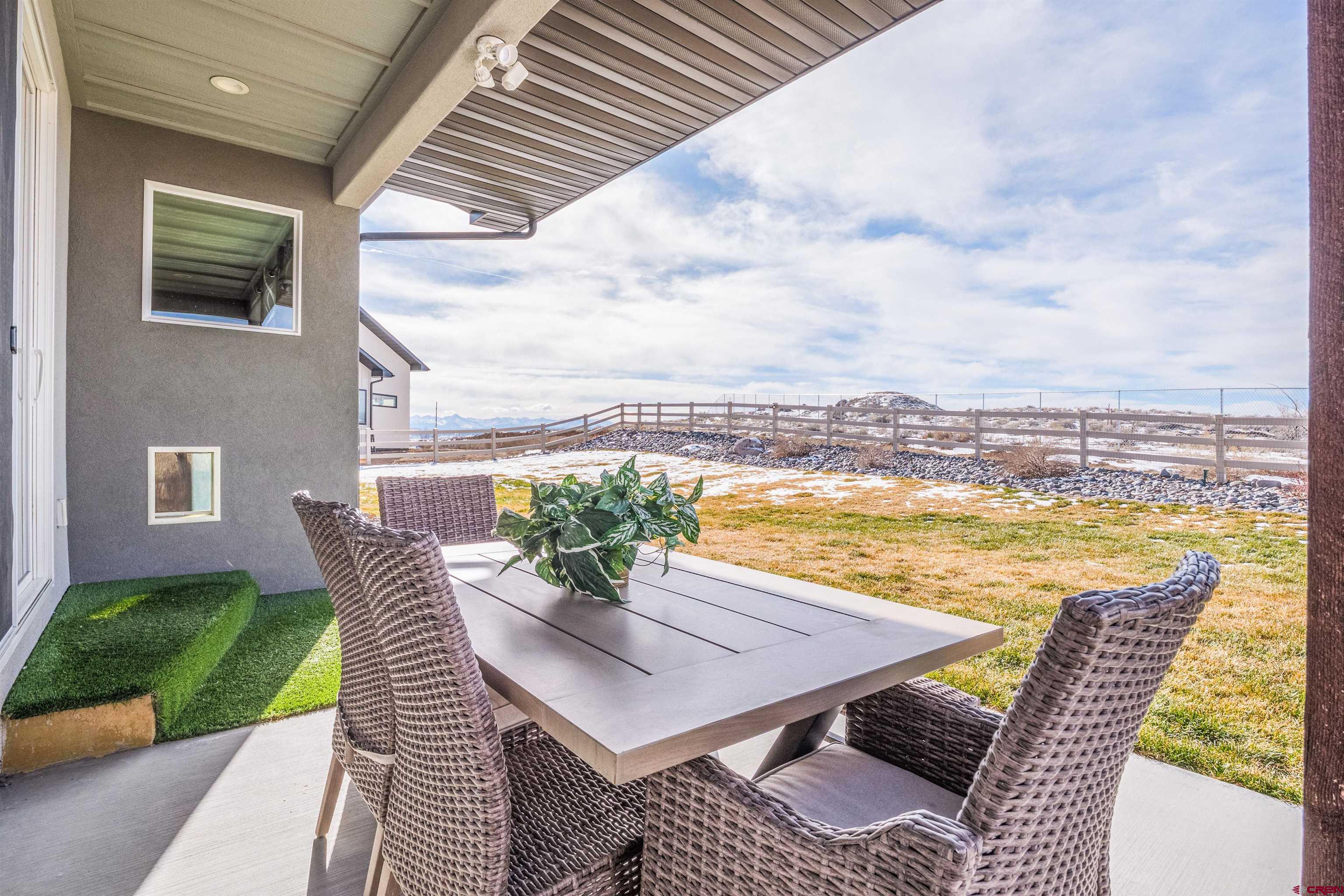 3614 Ridgeline Drive Montrose, CO 81401 - Photo 35 of 45 a view of a patio with lawn chairs