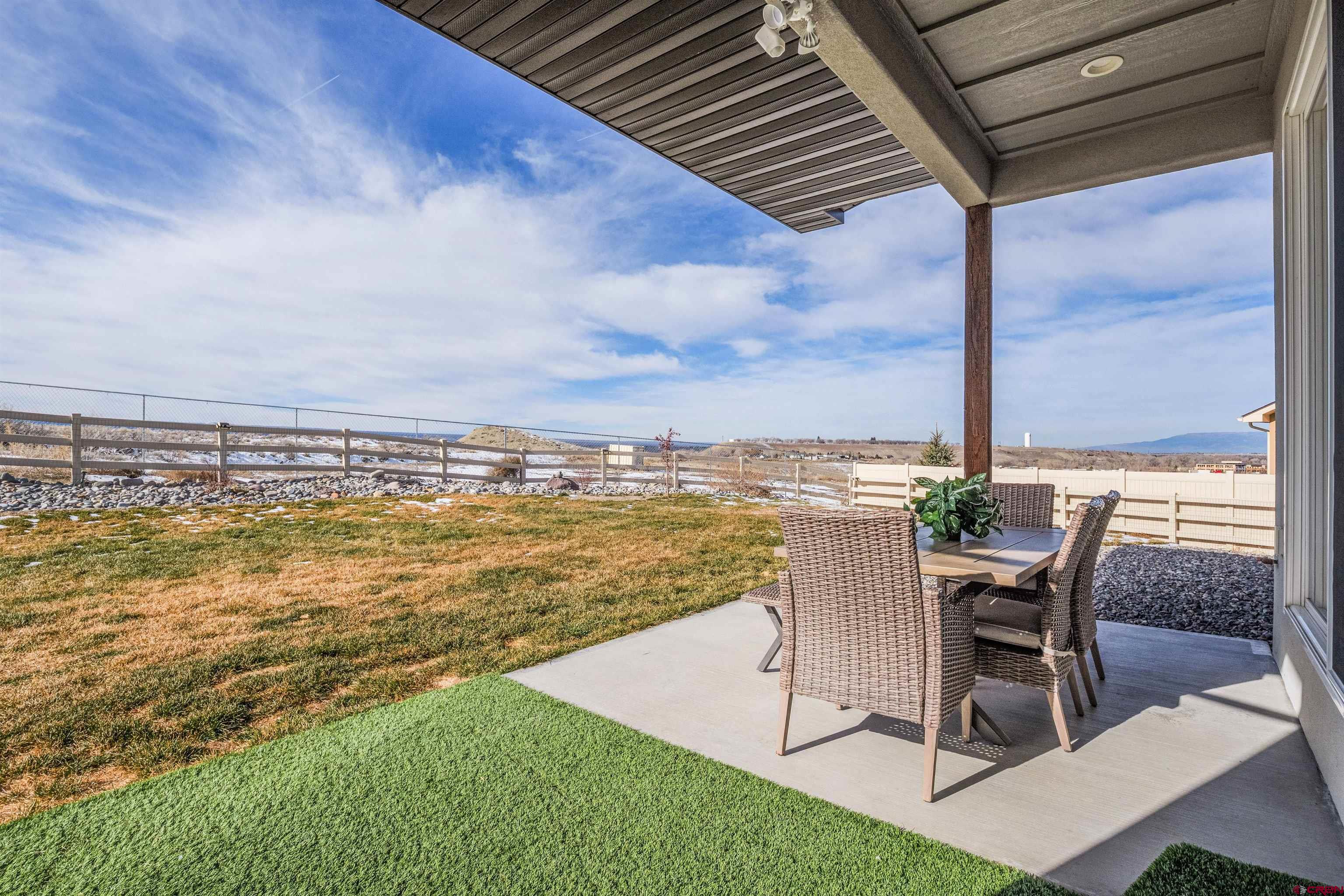 3614 Ridgeline Drive Montrose, CO 81401 - Photo 36 of 45 a view of a swimming pool with chair and table in the patio