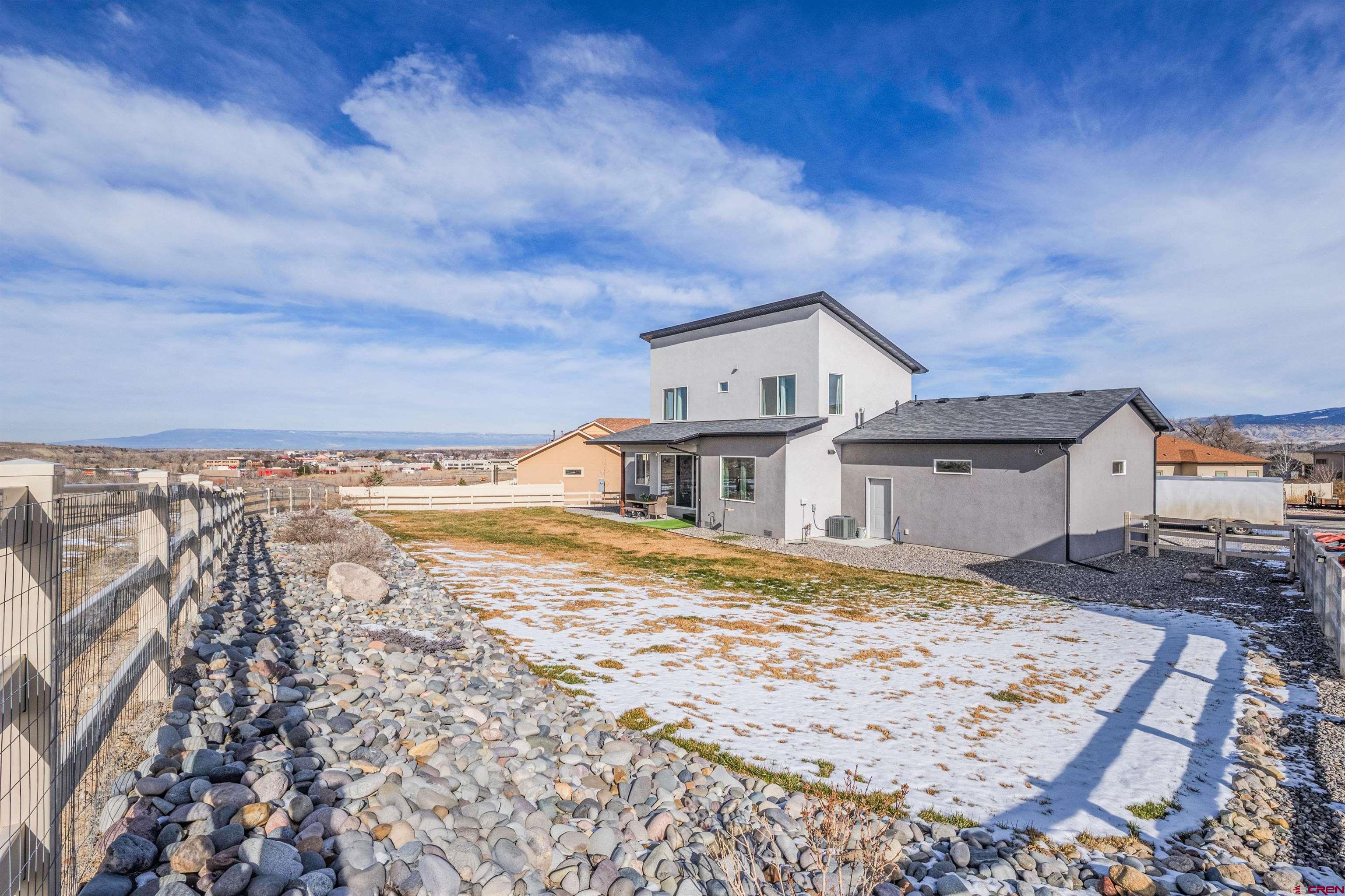 3614 Ridgeline Drive Montrose, CO 81401 - Photo 38 of 45 a view of a house with a yard