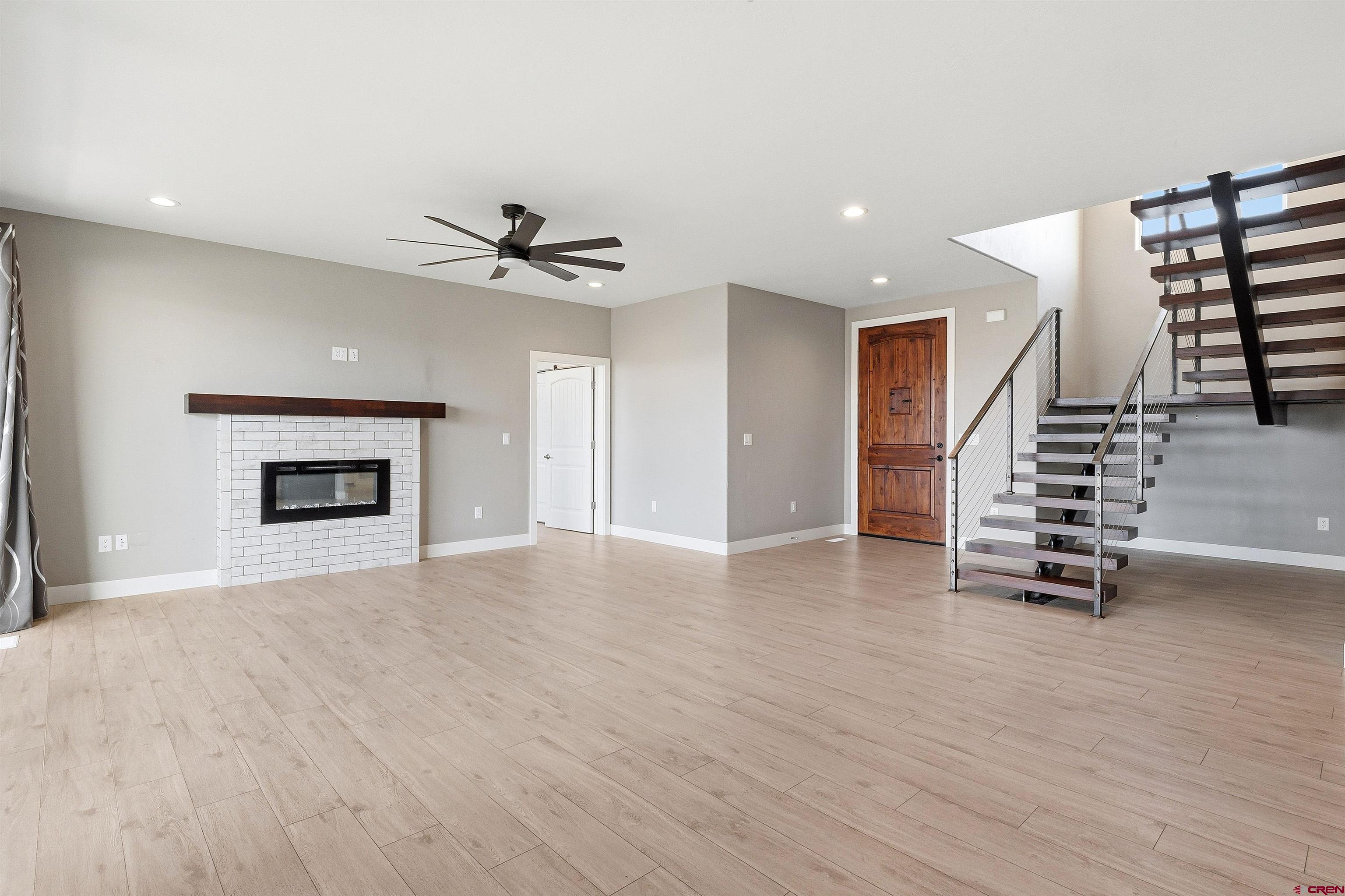 3614 Ridgeline Drive Montrose, CO 81401 - Photo 9 of 45 a view of an empty room with a ceiling fan and window