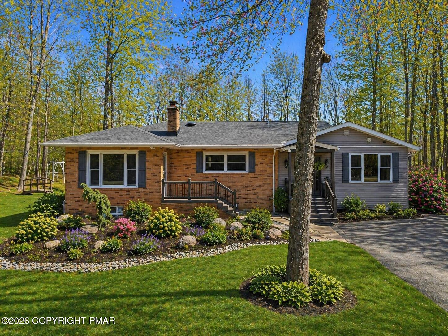 144 Highridge Road Albrightsville, PA 18210 - Photo 11 of 96 a front view of a house with a garden