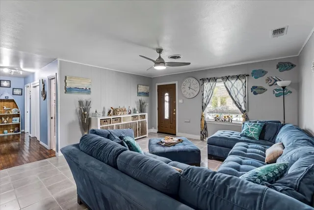 a living room with furniture and a large window