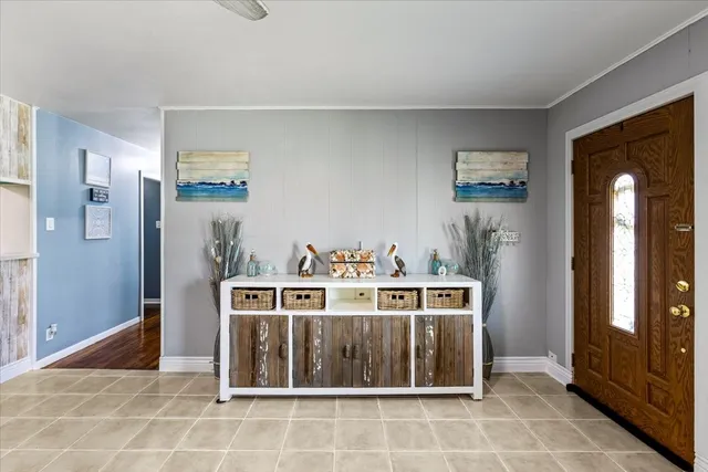 a view of a kitchen with stainless steel appliances granite countertop a stove a refrigerator and cabinets