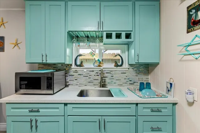 a kitchen with a stove and a microwave