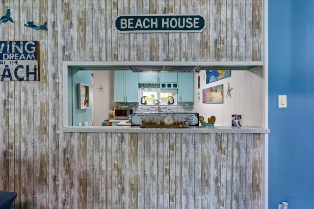 a kitchen with a stove and a table