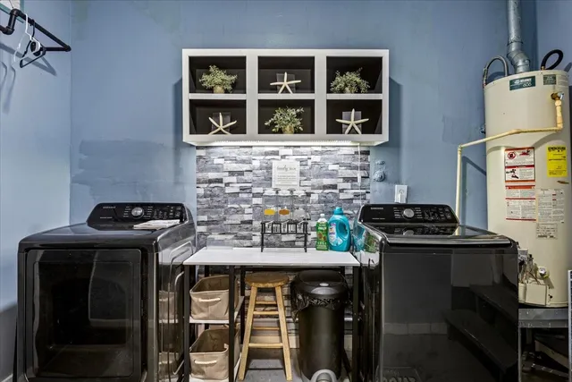 a view of a livingroom with a furniture and a ceiling fan