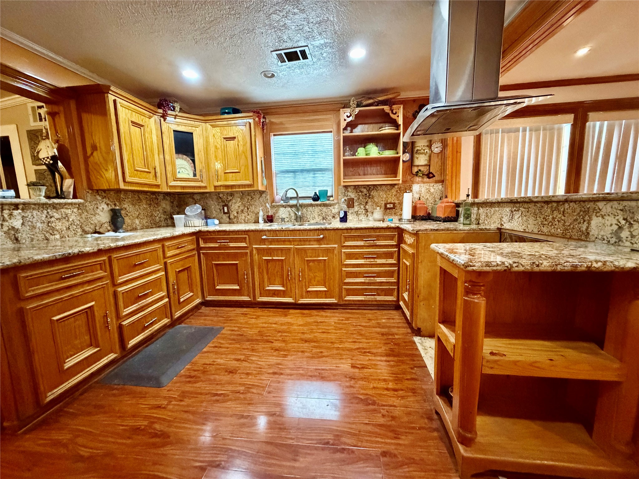 2609 Bevis Street Houston, TX 77008 - Photo 6 of 28 a large kitchen with granite countertop a sink and cabinets