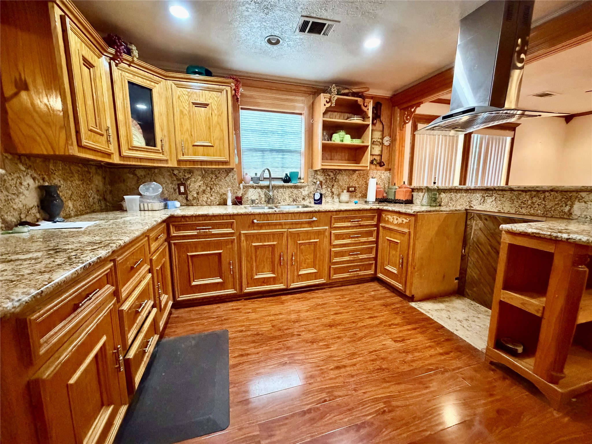2609 Bevis Street Houston, TX 77008 - Photo 7 of 28 a kitchen with stainless steel appliances granite countertop a sink and cabinets