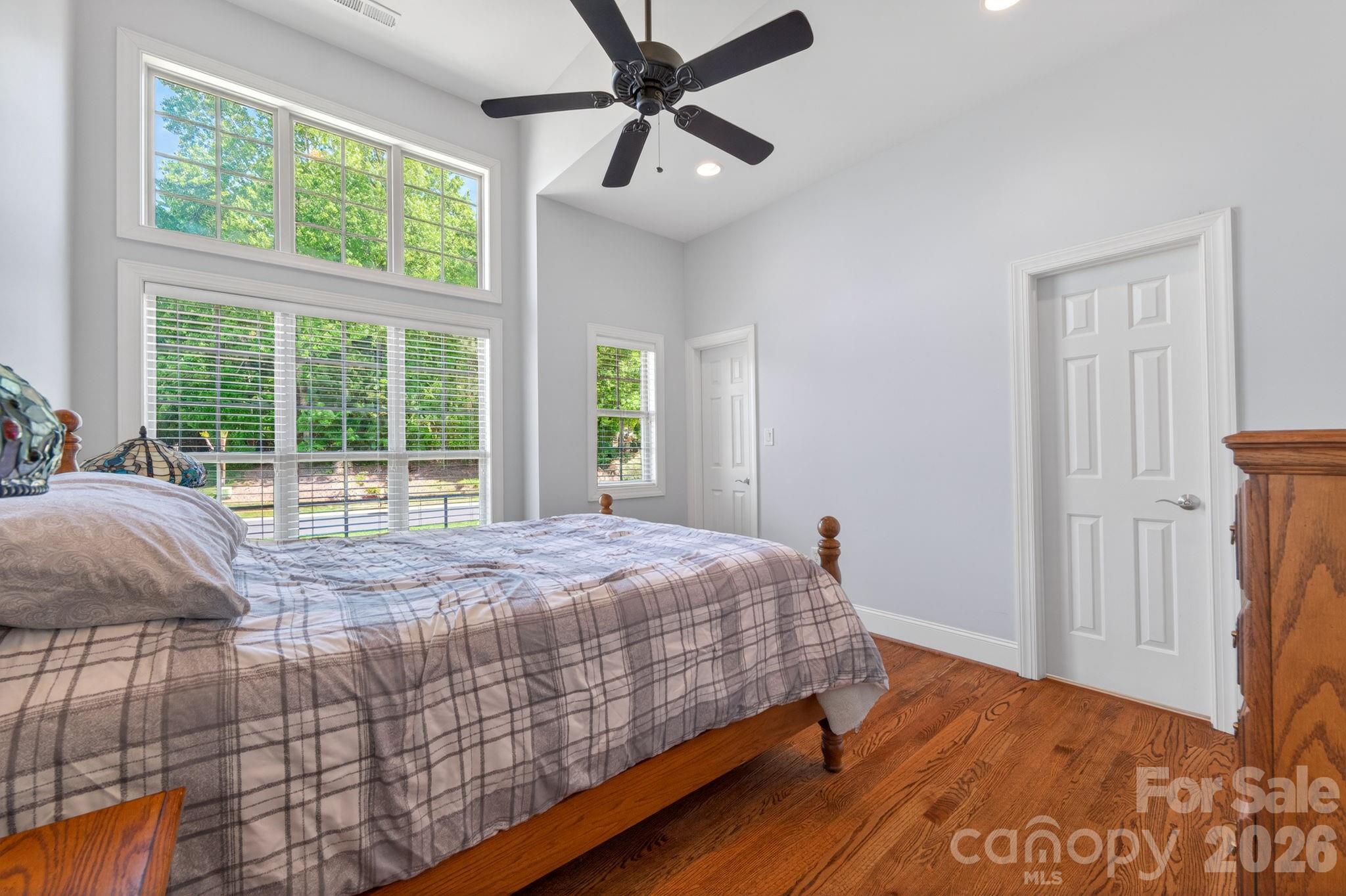 3138 Rappahannock Court, Unit 16 Matthews, NC 28104 - Photo 27 of 38 a bedroom with a bed and a large window