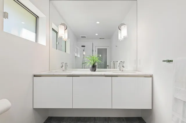 a bathroom with a sink and a mirror