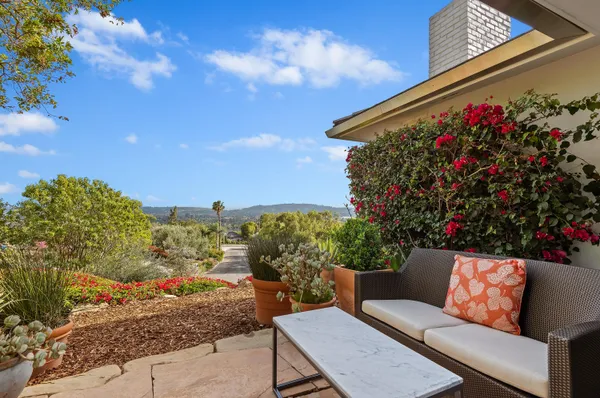 a outdoor living space with furniture and city view
