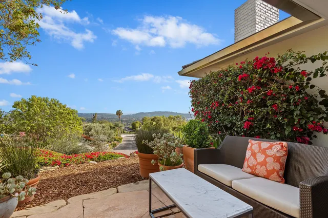 a outdoor living space with furniture and city view