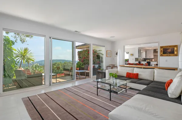 a living room with furniture and a table