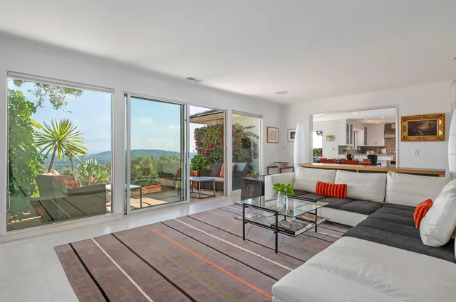 a living room with furniture and a table