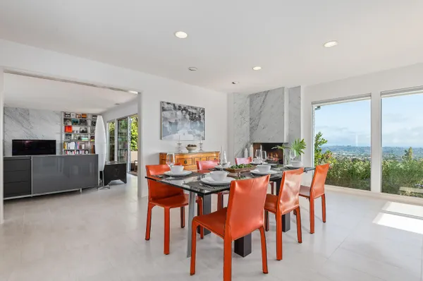 a dining room with furniture and window