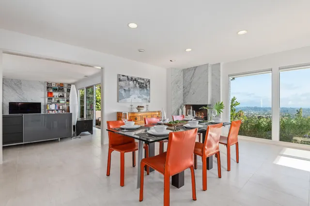 a dining room with furniture and window