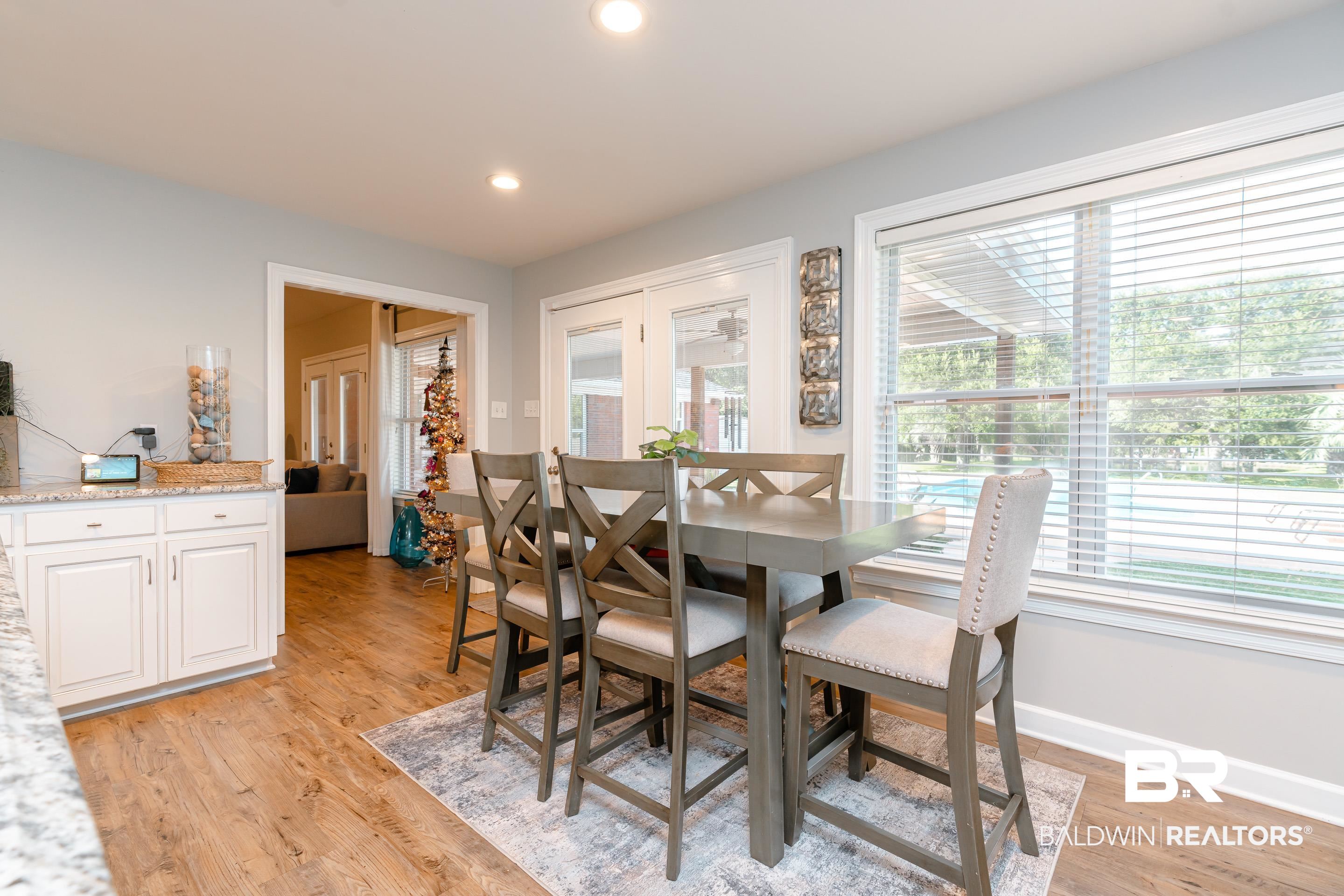 9477 Deerfield Drive Irvington, AL 36544 - Photo 15 of 58 Dining area featuring light wood-type flooring, plenty of natural light, and french doors
