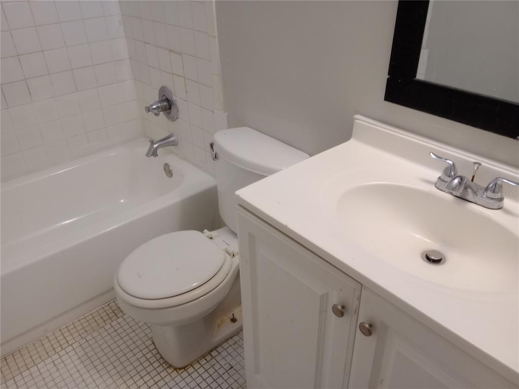 1217 Kennedy Road, Unit 53 Daytona Beach, FL 32117 - Photo 6 of 6 a bathroom with a sink toilet and shower