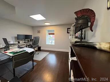 282 Bruce Park Avenue, Unit 2 Greenwich, CT 06830 - Photo 14 of 25 a view of a workspace with furniture and a window