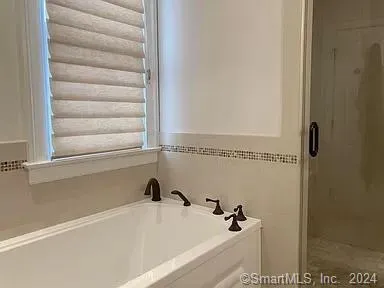 a view of a bathtub in a bathroom