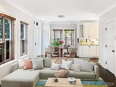 a living room with furniture and windows