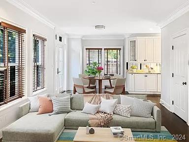 282 Bruce Park Avenue, Unit 2 Greenwich, CT 06830 - Photo 2 of 25 a living room with furniture and windows
