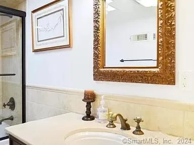 a bathroom with a sink and a mirror
