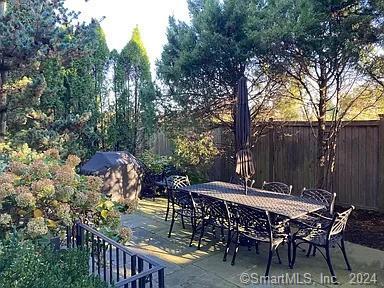 282 Bruce Park Avenue, Unit 2 Greenwich, CT 06830 - Photo 24 of 25 a view of a chairs and table in the patio