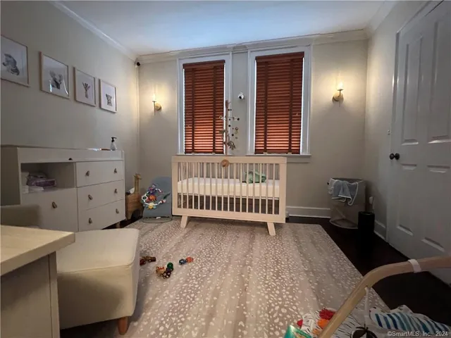 a bed room with a bed and a window