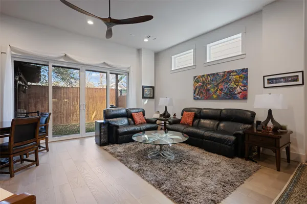a living room with furniture or couch and a large window