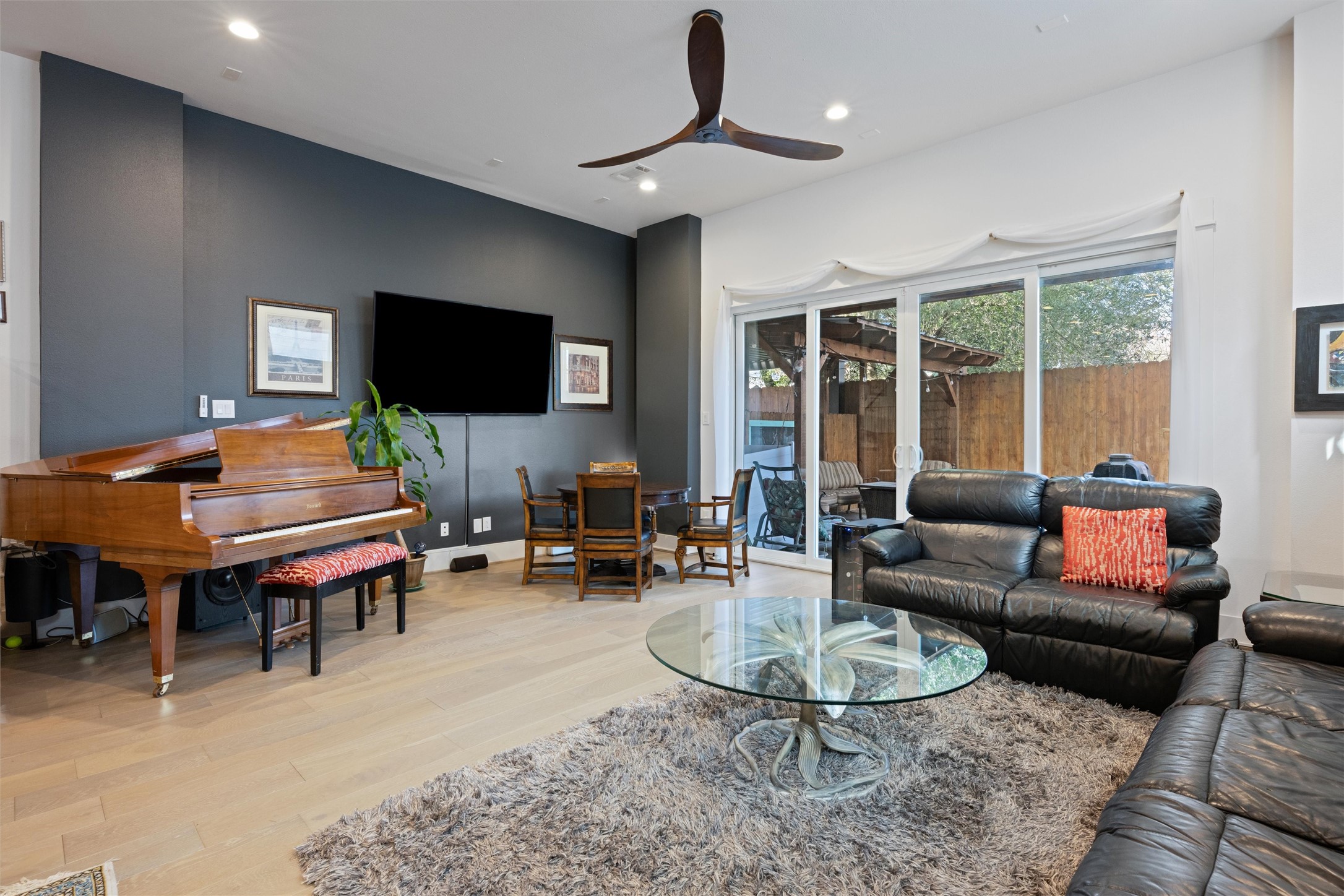 1136 Adele Street Houston, TX 77009 - Photo 12 of 28 a living room with furniture a flat screen tv and a fireplace