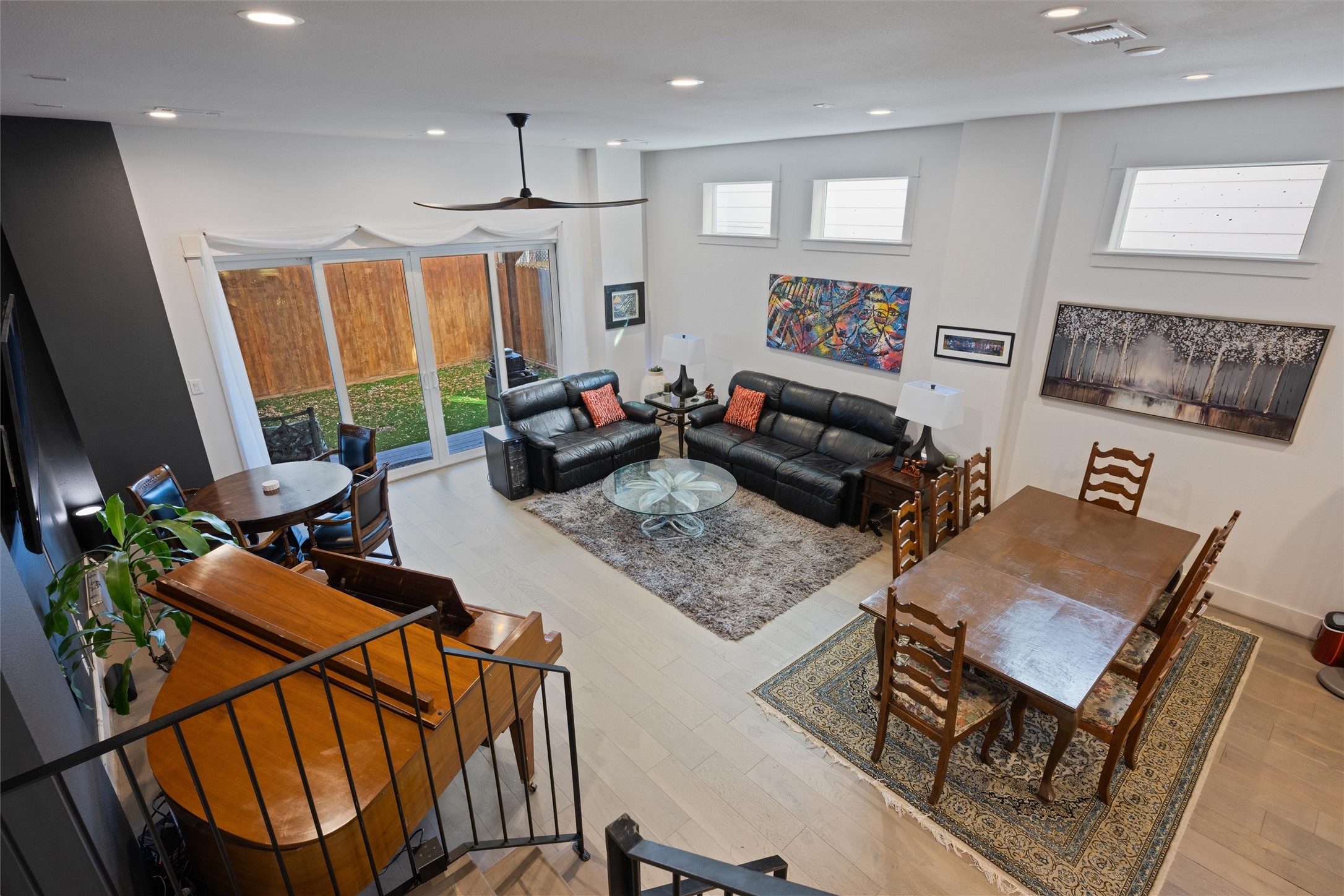 1136 Adele Street Houston, TX 77009 - Photo 14 of 28 a living room with furniture a flat screen tv and a large window