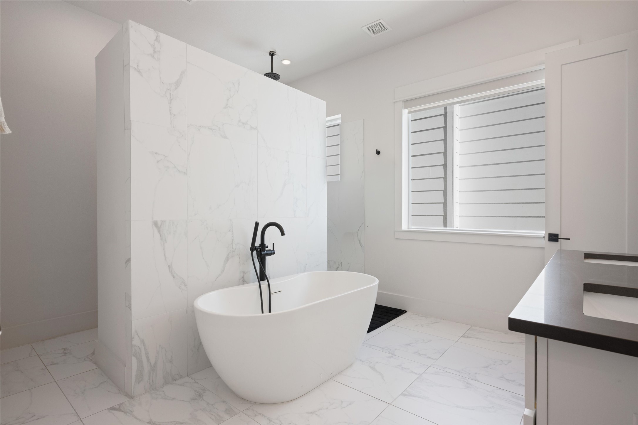 1136 Adele Street Houston, TX 77009 - Photo 20 of 28 a white bath tub sitting in a bathroom