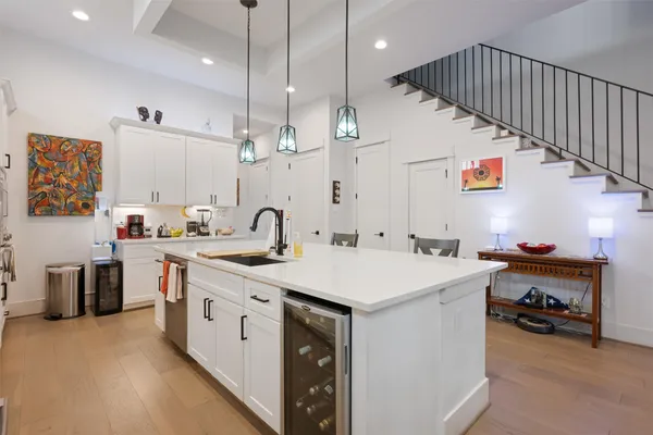 a utility room with sink dryer and washer