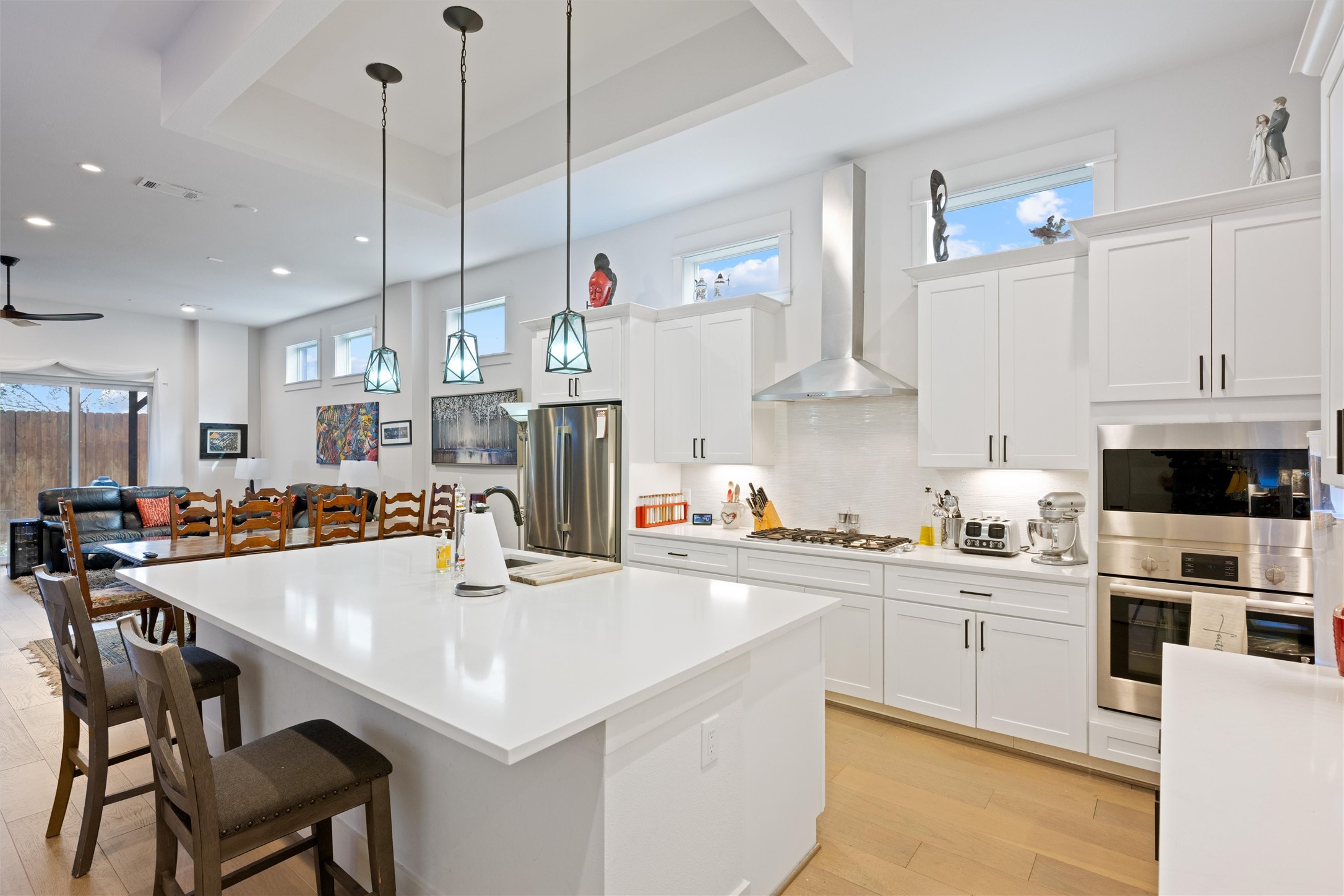 1136 Adele Street Houston, TX 77009 - Photo 6 of 28 a kitchen with stainless steel appliances a table a sink and a stove top oven