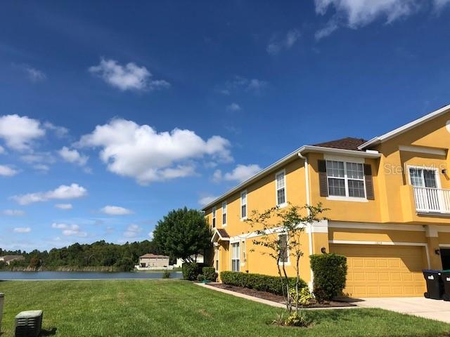 10824 Derringer Drive Orlando, FL 32829 - Photo 1 of 1 a view of a house with a yard