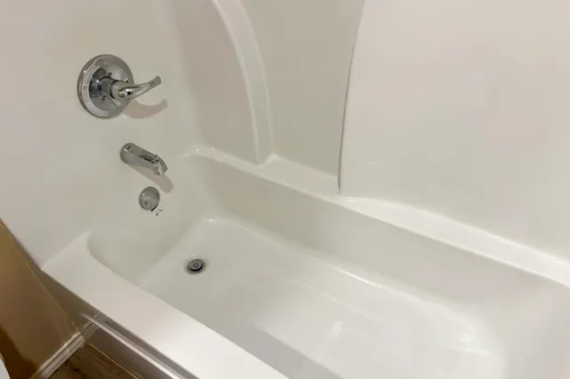 a bathroom with a sink and mirror